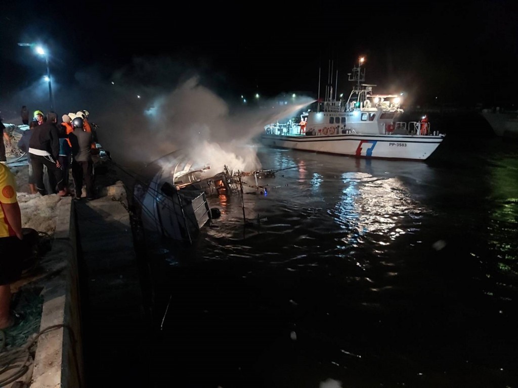 Firefighters battle fire aboard boat on Taiwan's outer island